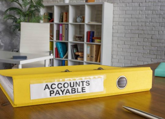Folder with label accounts payable on the table.
